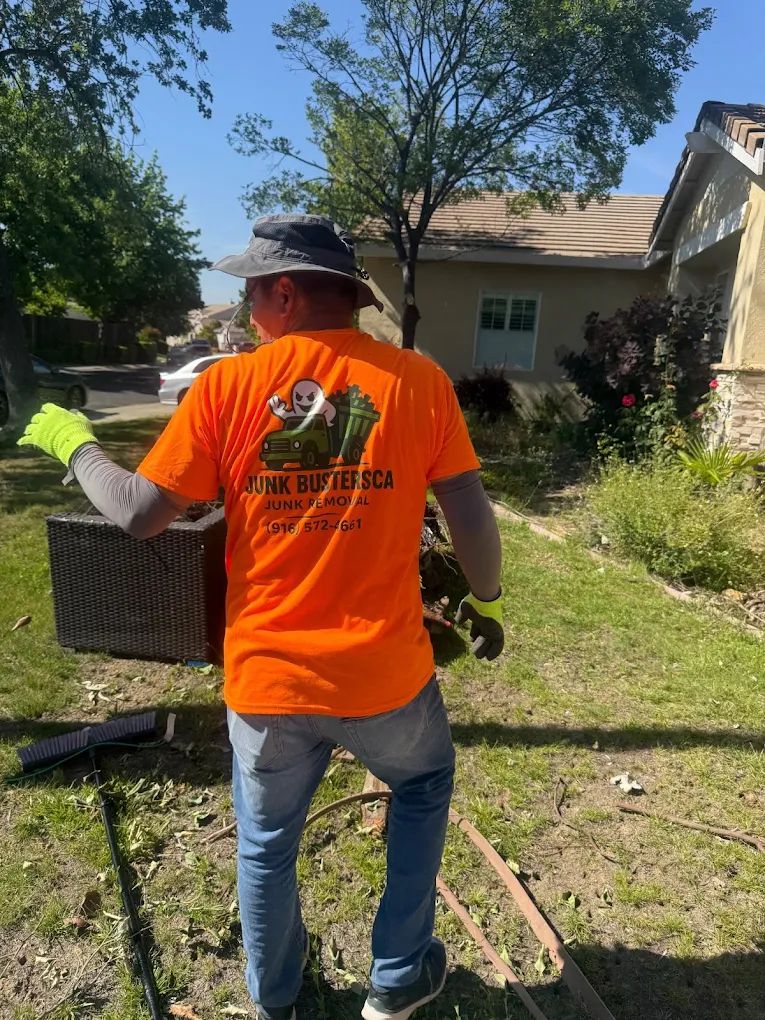 Junk Busters CA crew member loading a truck