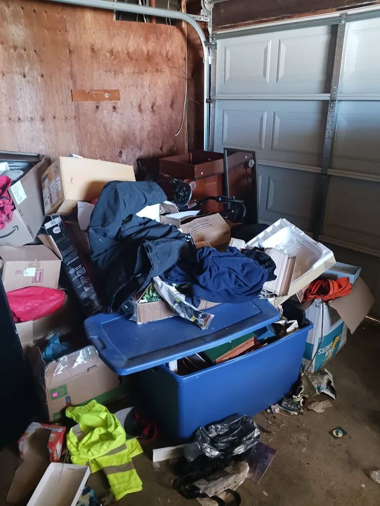 A cluttered garage before a cleanout